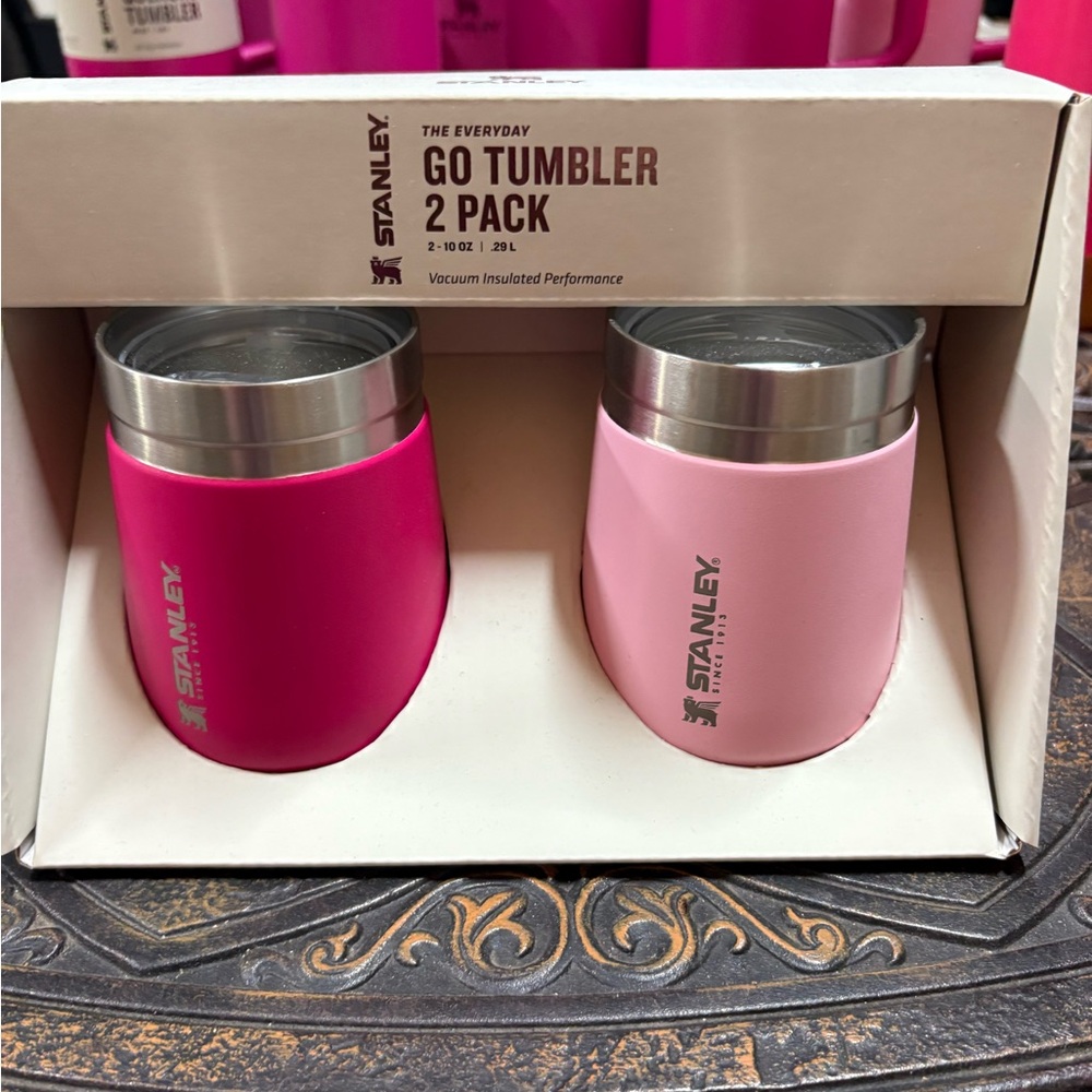 Stanley go cups light peony and Cosmo colored, bnnu on my self for display.